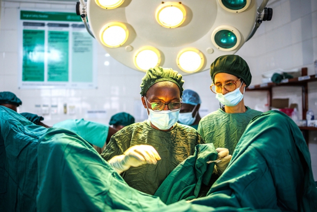 Dr. Priscilla Busingye, an accomplished fistula (birth injury) surgeon performs a birth injury surgery at Karoli Lwanga hospital, Nyakibaale western Uganda. Dr. Priscilla, a consecrated nun with the Catholic Banyatereza Sisters of Uganda, is the first woman and first African physician to win the L&rsquo;Chaim Prize. Sister Priscilla is now one of only a handful of such specialists in all of Uganda, and a rare resource for the rural communities she serves. - Shot on assignment for African Mission Healthcare 2022
