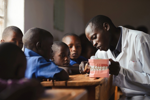 Dental Health Without Borders (Tandsundhed Uden Gr&aelig;nser ) / (TUG) is a Danish NGO aiming to improve life possibilities for children in some of the world&rsquo;s poorest countries through better dental health. Toothaches make it hard to focus on school, and however simple it may sound, it&rsquo;s the reality for many children in some of the poorest countries of the world. By spreading the Danish model for school dental care to the world&rsquo;s &ldquo;poorest&rdquo; countries, TUG is looking at establishing sustainable dental development projects to ensure happier and healthier children.  TUG teaches school children how to take care of their teeth through daily toothbrushing programs in school. They collaborate with local NGOs and involve teachers, parents, health workers and dental professionals in order to create sustainable health models which can be continued locally. They also engage in dialogues with policymakers to advocate for school-based dental care on national and regional levels. - &copy; Jjumba Martin, Tandsundhed Uden Gr&aelig;nser 2017 (Rwanda)