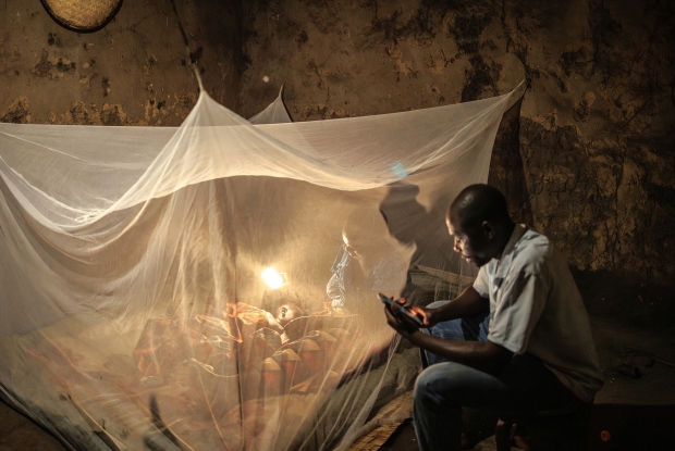 Balaka, Malawi November 2024. A mother pampers a baby to sleep under a PermaNet Dual mosquito net. Malawi is among the top 20 countries with the highest malaria prence and mortality rates. Luckily, Malawi and several other countries have seen transformative innovations, including long-lasting insecticide-treated nets, which have halved malaria mortality rates over the last two decades. Next-generation nets like PermaNet Dual include two active ingredients, adding chlorfenapyr to a pyrethroid, and have proved to enhance significant efficacy compared to other nets. They also address the issue of insecticide resistance. &copy; Jjumba Martin, Vestergaard 2024.