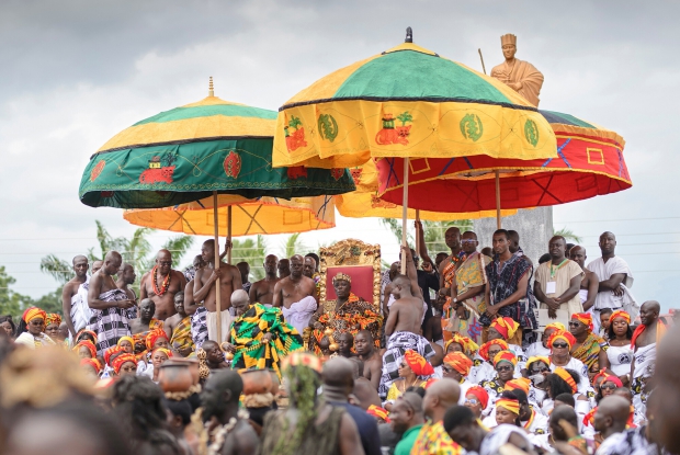 His Majesty Osagyefuo Nana Amoatia Ofori Panin Okyenhene sits on a guarded throne at the event.  &copy; Jjumba Martin 2018