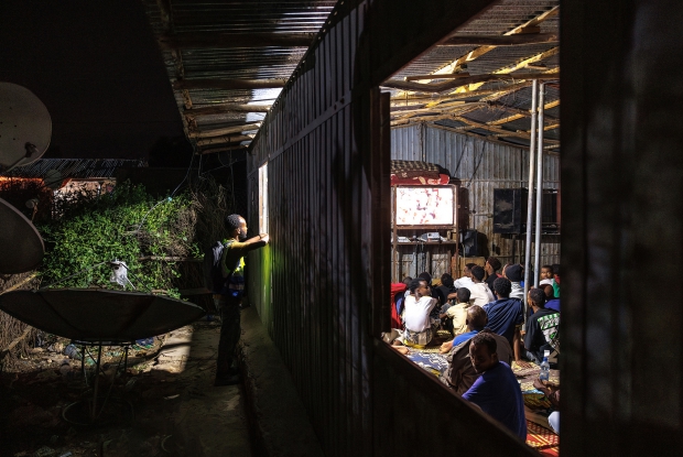 12.05.2024, Sheder refugee camp, Northeastern Fafan Zone in the Somali region of Ethiopia. People watching a live soccer match at a local cinema hall that was connected to the grid.