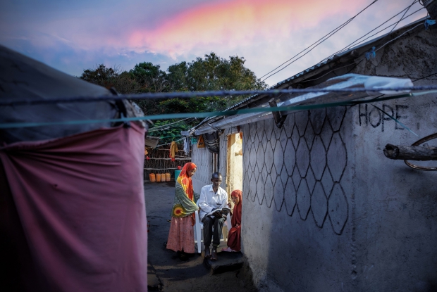 11.05.2024, Sheder refugee camp, Northeastern Fafan Zone in the Somali region of Ethiopia. 58-year-old Muse takes two of his daughters through a school exercise with the use of light from the inside of one of the rooms in his compound. The family of 14 had lived in the Sheder refugee camp for 10 years after fleeing AL Shabab in the homeland of Somalia. Not long ago, diesel-powered generators permeated throughout Sheder Refugee Camp, providing some access to electricity to homes like Muse&rsquo;s. However, it was costly to operate so, it only lasted two to three hours a day. Through The Enter Energy initiative, Mercy Corps&rsquo; flagship energy program, more than 1,000 households in the camp were connected to reliable and sustainable energy after the construction of a 254 KW solar mini-grid station, the country&rsquo;s first commercially licensed private solar PV-powered mini-grid. Humanitarian Energy customers have access to prepaid renewable energy, 24 hours a day&mdash;at half the cost of what they used to pay for two hours of diesel-powered electricity. &copy; Jjumba Martin for Mercy Corps 2024.