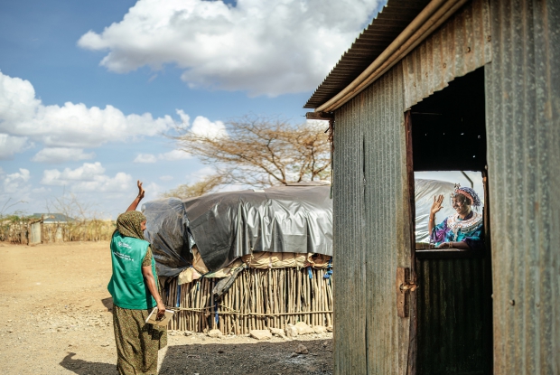 13/03/2025 Logologo , Marsabit county, Kenya. Hirsi waves at her busness mentor. Village Enterprise Business Mentors are individuals, often sourced from the communities they serve, who provide crucial support to entrepreneurs within the program. They act as trainers, mentors, and community leaders, guiding participants through the process of launching and growing sustainable businesses. This includes training in financial literacy, business skills, and group dynamics, as well as providing ongoing support and guidance.