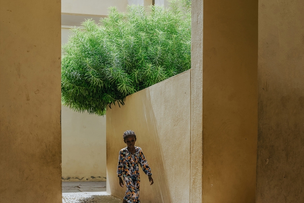 Architectural exterior of SOS Children&rsquo;s Village Tadjourah, Djibouti, featuring narrow streets and shaded communal spaces.