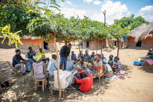 October 4th, 2022-, Bidibidi Refugee settlement, Uganda. 30-year-old Festo, the Vice chairperson of Ala-Zabu savings group, attends one of the group meetings. Under the DREAMS program, a consortium of Mercy Corps, Village Enterprise and IDinsight, support has been extended to the savings group comprising refugees from South Sudan to work together, save money, start businesses, to become self-reliant. Here, the members of the savings group have gathered to save money and review their goals. The members have been trained by business mentors from Village Enterprise in financial literacy, budgeting and record keeping.