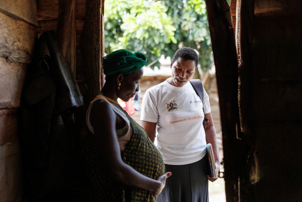 Nantumbwe Judith, the Living Goods Community Health Worker in the Lwabaswa-Buvuma landing site and fishing village in Kalangala District visits expectant mother on the island. Living Goods empowers community health workers with the capacity to provide basic guidance to expectant mothers in rural communities.