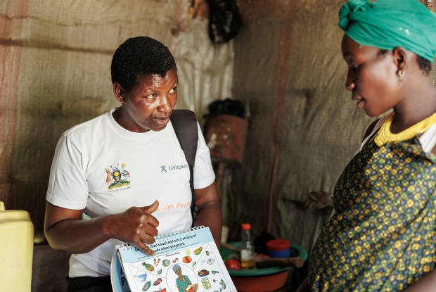 Judith, the Community Health Worker in the Lwabaswa-Buvuma landing site and fishing village in Kalangala district offers nutrition advice to an expectant mother on the island. Community health workers educate women on the importance of good nutrition, both for themselves and their children, and provide practical advice on preparing nutritious meals, especially using locally available resources