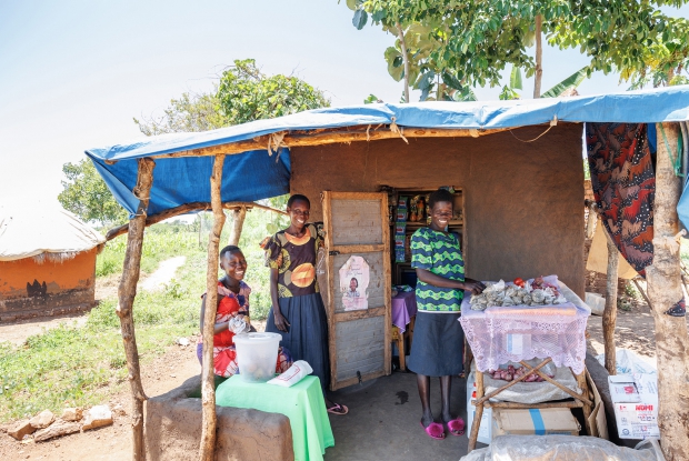 October 6th 2022- Yumbe district- Uganda.  Bidi bidi refugee settlement. Charity , Juan  and Atiku, members of the Saidu Business Group share a light photo moment outside their business. This business was set up by three refugee women from Sudan. The business group deals in general merchandise.  Under the DREAMS Program, Village enterprise supported the business group with UGX 432,000 under phase 1 and if a  business grows, they receive additional financial support.