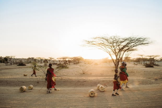 March 24, 2025 Korr, in the Marsabit county of Kenya. - Like in many other desert areas, water scarcity is a severe issue among the Rendille, impacting the community's well-being and daily lives. This makes it difficult to sustain agriculture, leading to challenges in securing enough food and increasing the burden on women and girls who must travel long distances to find water. The community relies heavily on artesian wells. The way they roll jerrycans on the ground is quite a scene. - &copy; Jjumba Martin 2025.